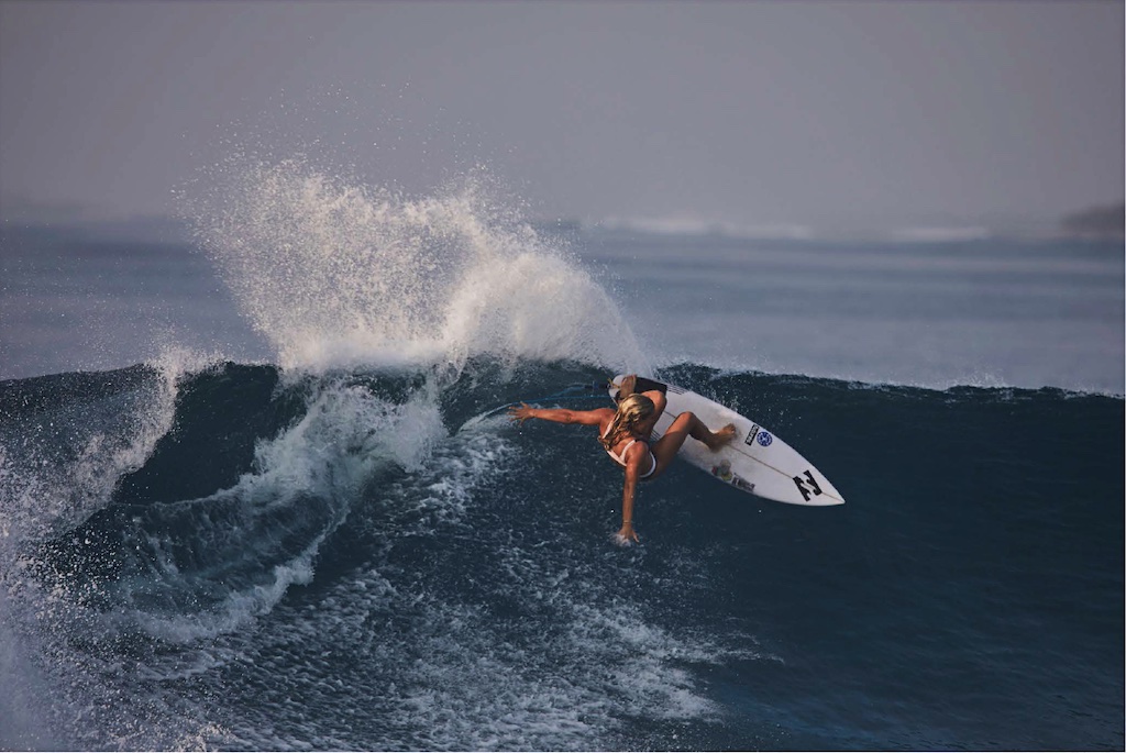 Photo of Felicity Palmateer surfing